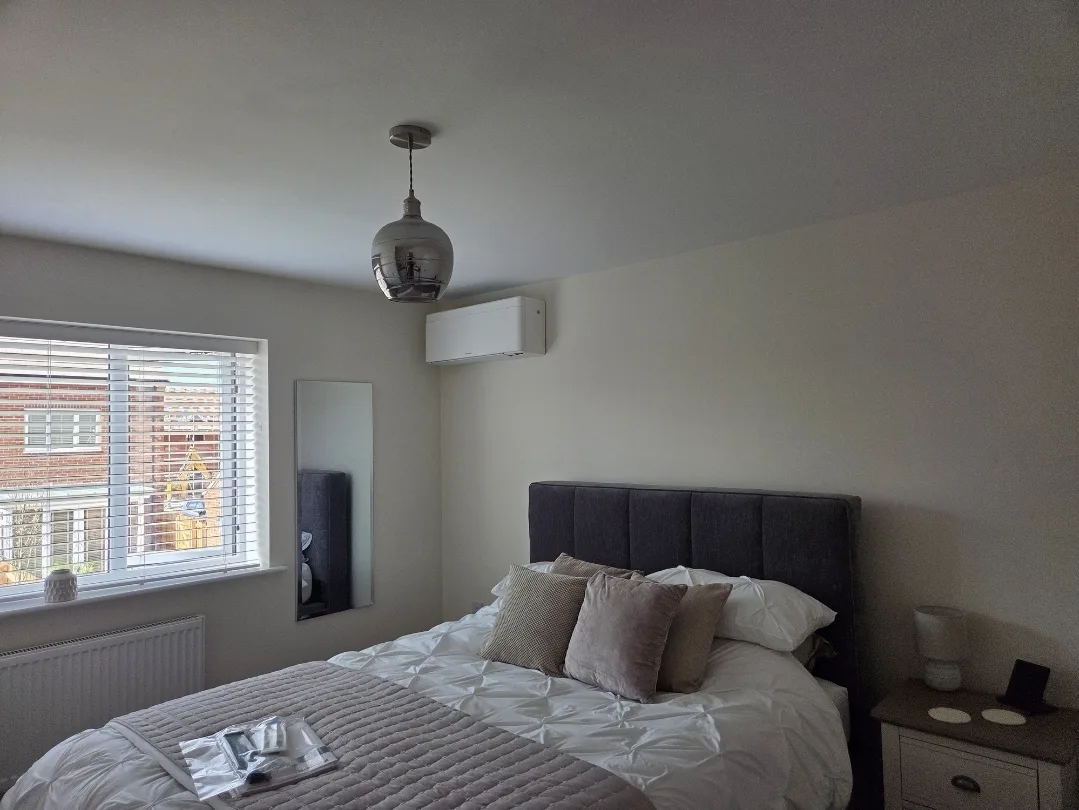 Chillmasters wall-mounted AC unit installed in a bedroom