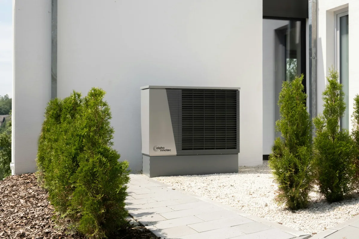 Air-to-air heat pump indoor unit delivering warm air into a room