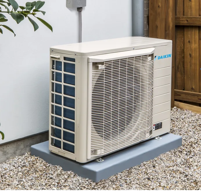 Chillmasters engineer installing an air-to-air heat pump
