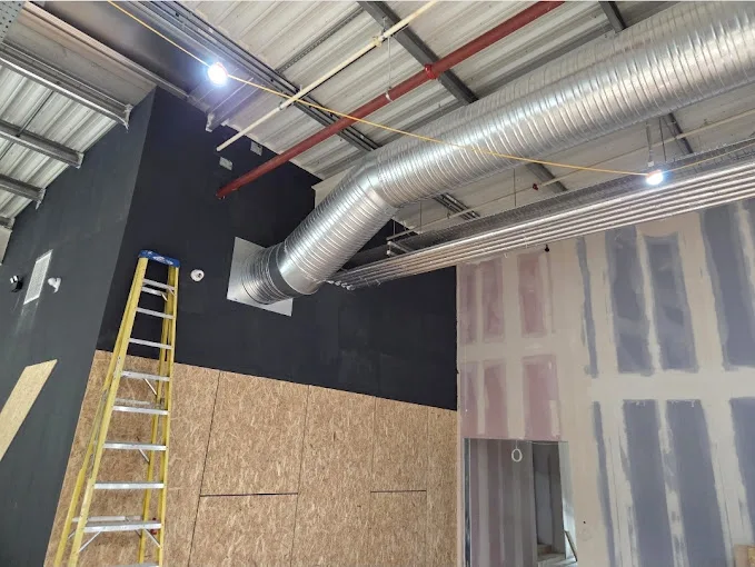 Chillmasters engineer installing an air conditioning system